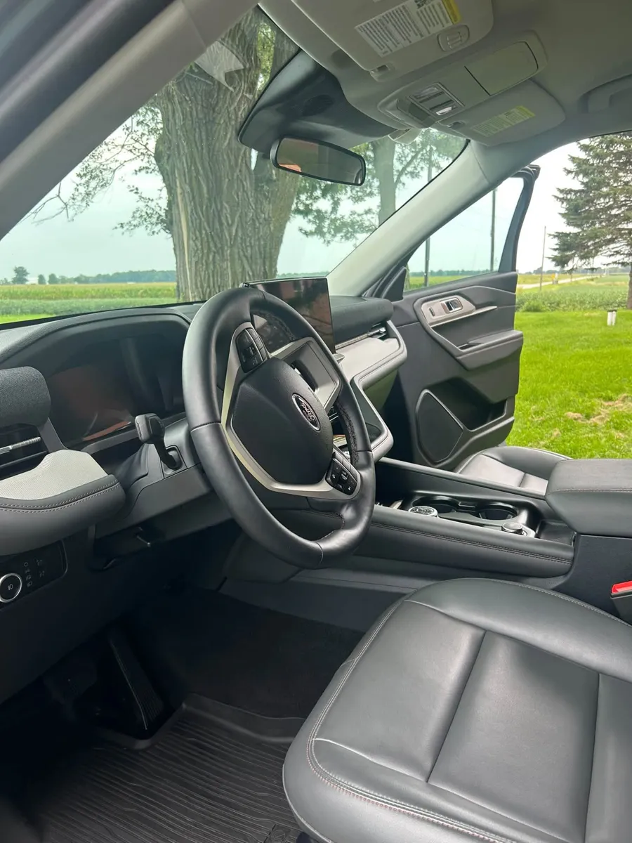 Black leather SUV driver side after detailing