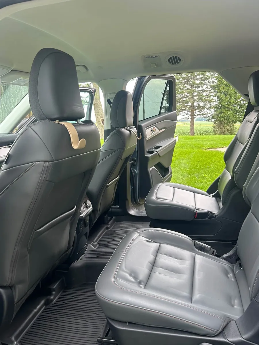 Black leather SUV rear seats after detailing