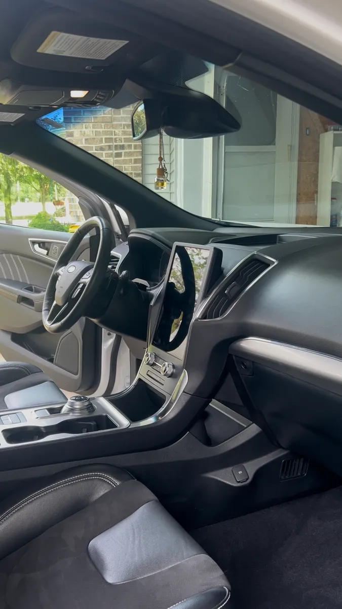 Gray SUV dash and front seats after detailing