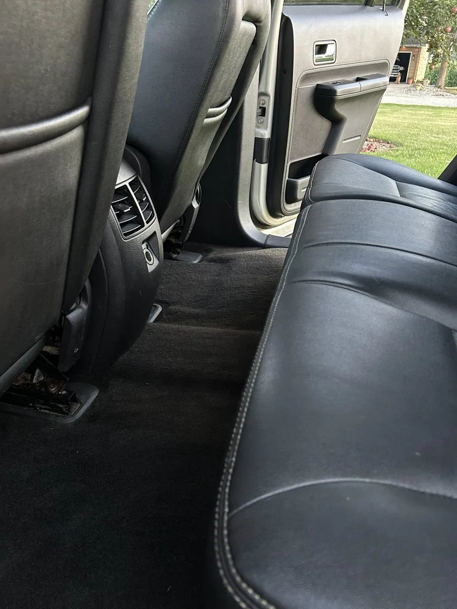 Black leather rear seat after an interior detail