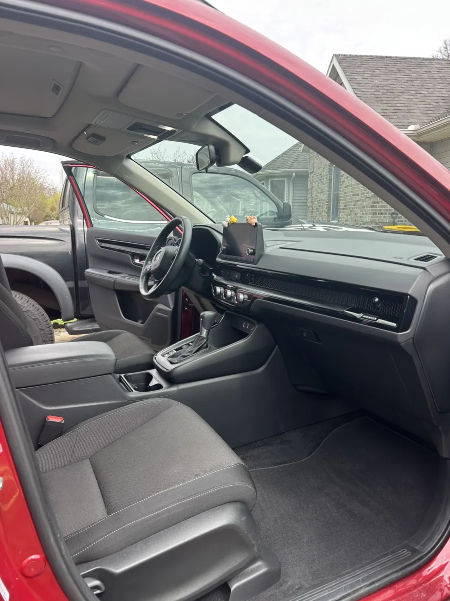 Red SUV dash and console after detailing