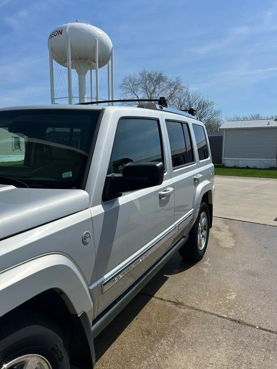 Silver Jeep Commander after an exterior wash